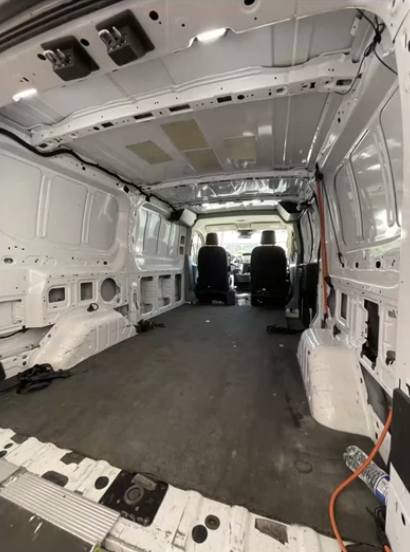 Bare Ford Transit cargo area with no wall protection